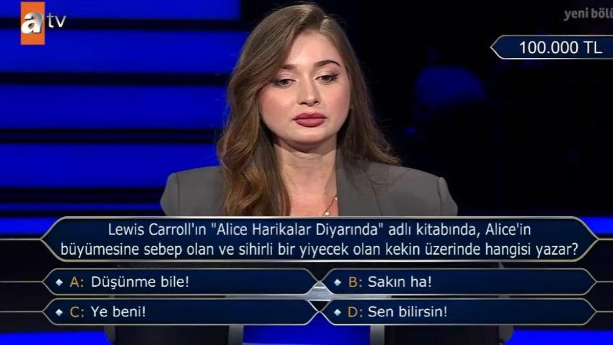 Alice Harikalar Diyarı kitabı! Alice’in büyümesine sebep olan ve sihirli bir yiyecek olan kekin üzerinde hangisi yazar?